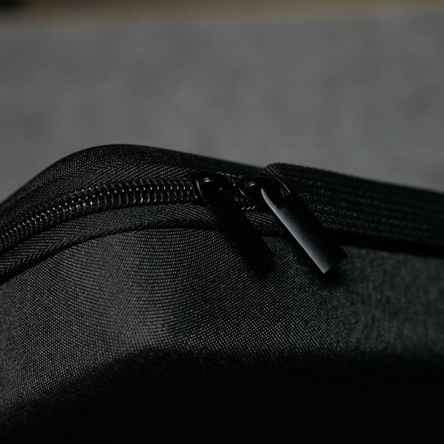 Close-up of a Akko Keyboard Carrying Case on a textured black surface