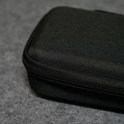 Black Akko Keyboard Carrying Case on a gray textured surface