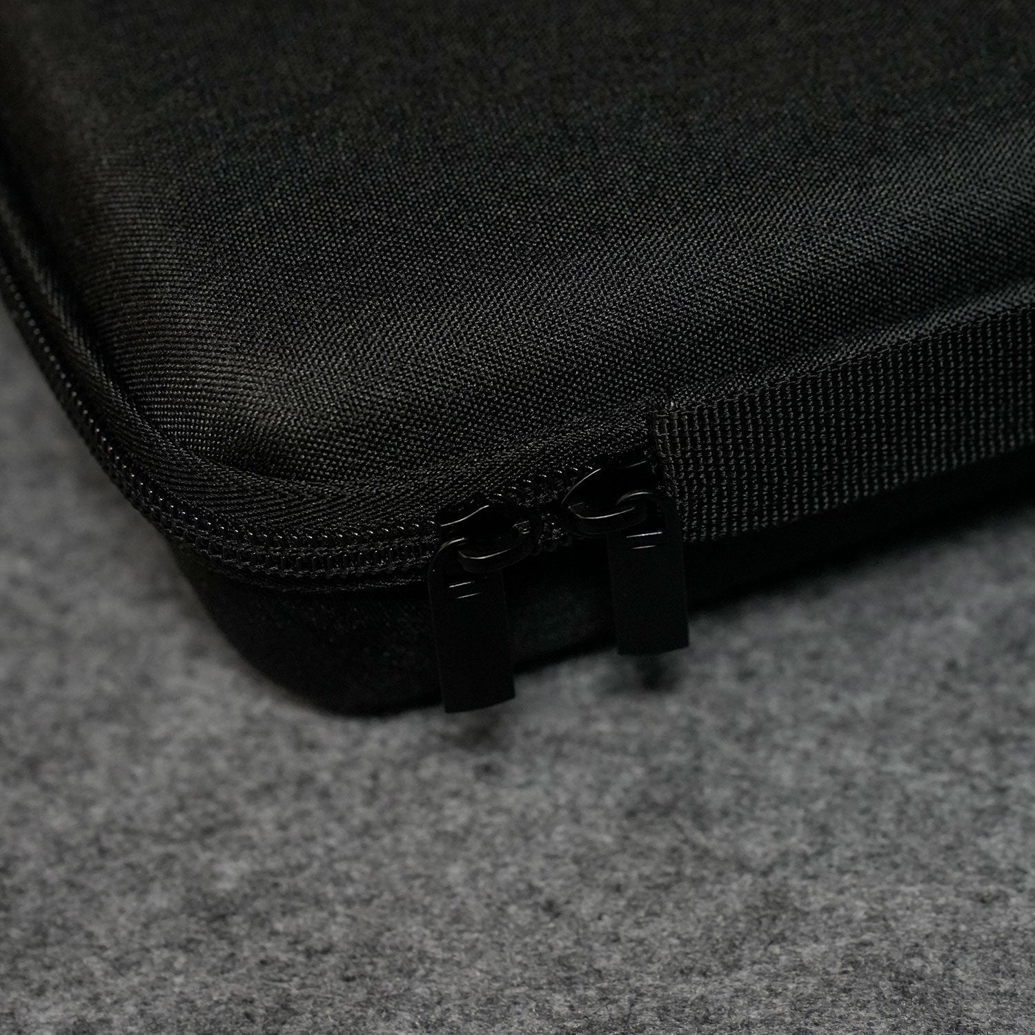 Close-up of a Akko Keyboard Carrying Case on a gray surface