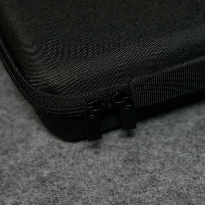 Close-up of a Akko Keyboard Carrying Case on a gray surface