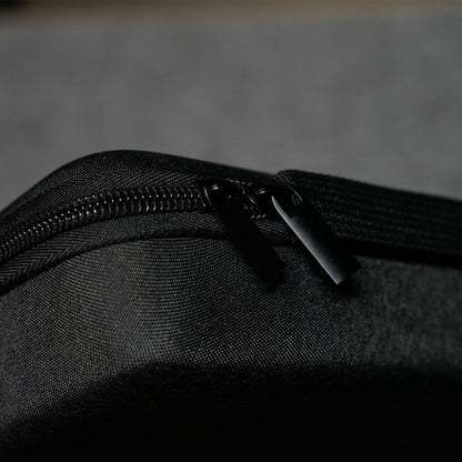Close-up of a Akko Keyboard Carrying Case on a textured black surface